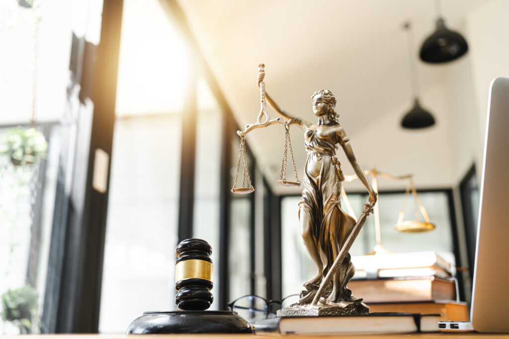 Law scales of justice and gavel Getty