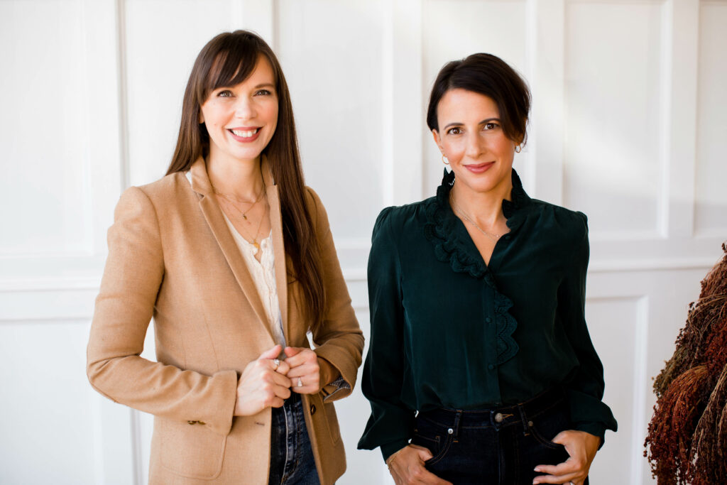 A photo of Alicia Held-Morris and Jillian Lare. Alicia is wearing a tan jacket, and Jillian is wearing a black shirt.