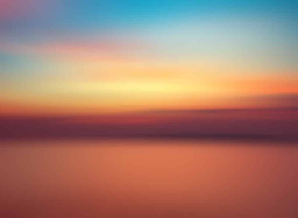 Motion blurred background of sunset on the sea